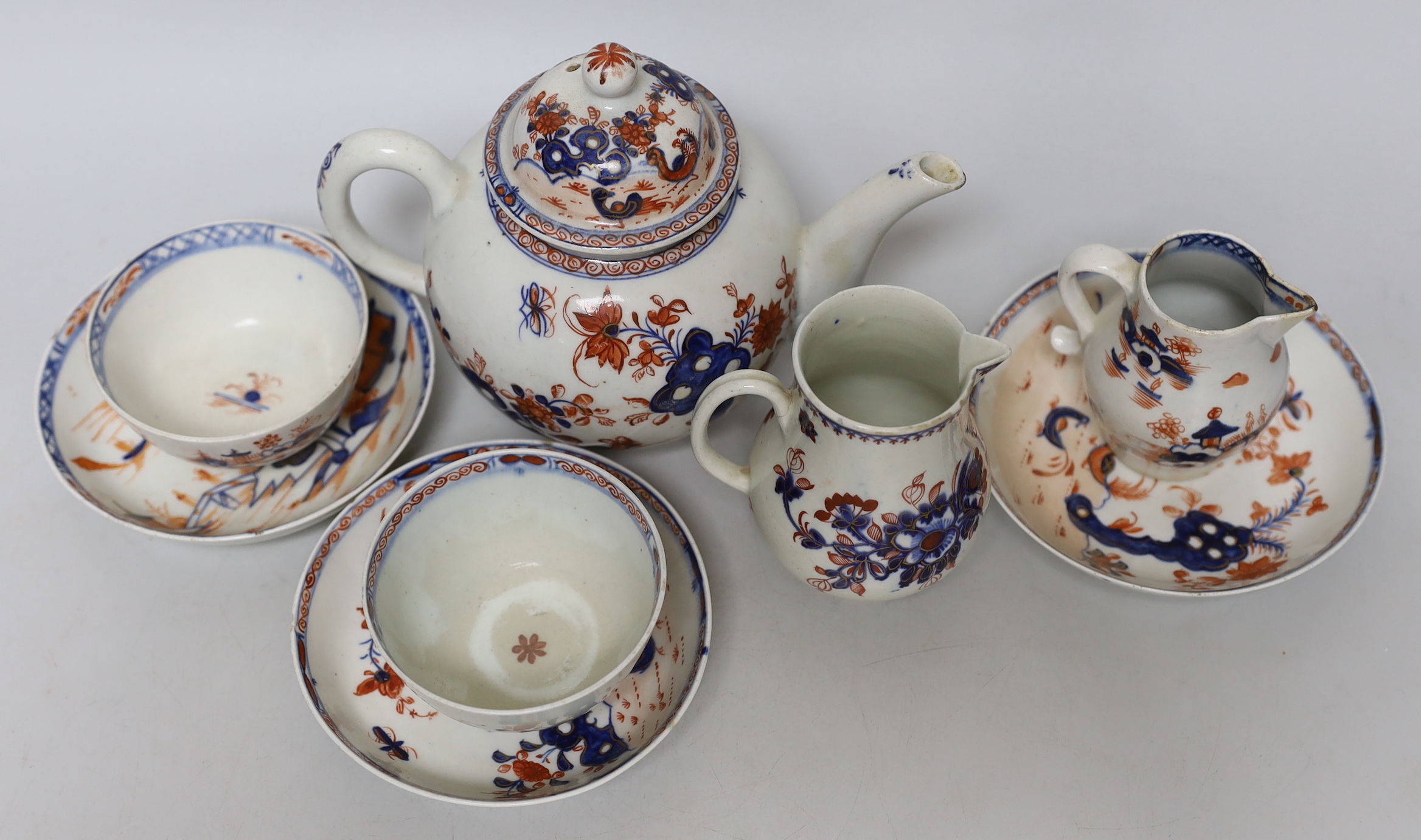 A group of Lowestoft Imari teawares, c.1770, including a Redgrave two bird pattern teapot and cover, tea bowl and two saucers, a Dolls House pattern sparrow beak cream jug and teabowl with saucer and a further sparrow be